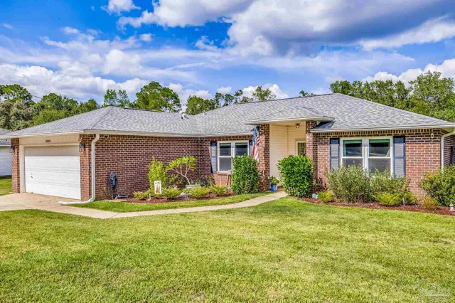 a front view of house with yard and green space