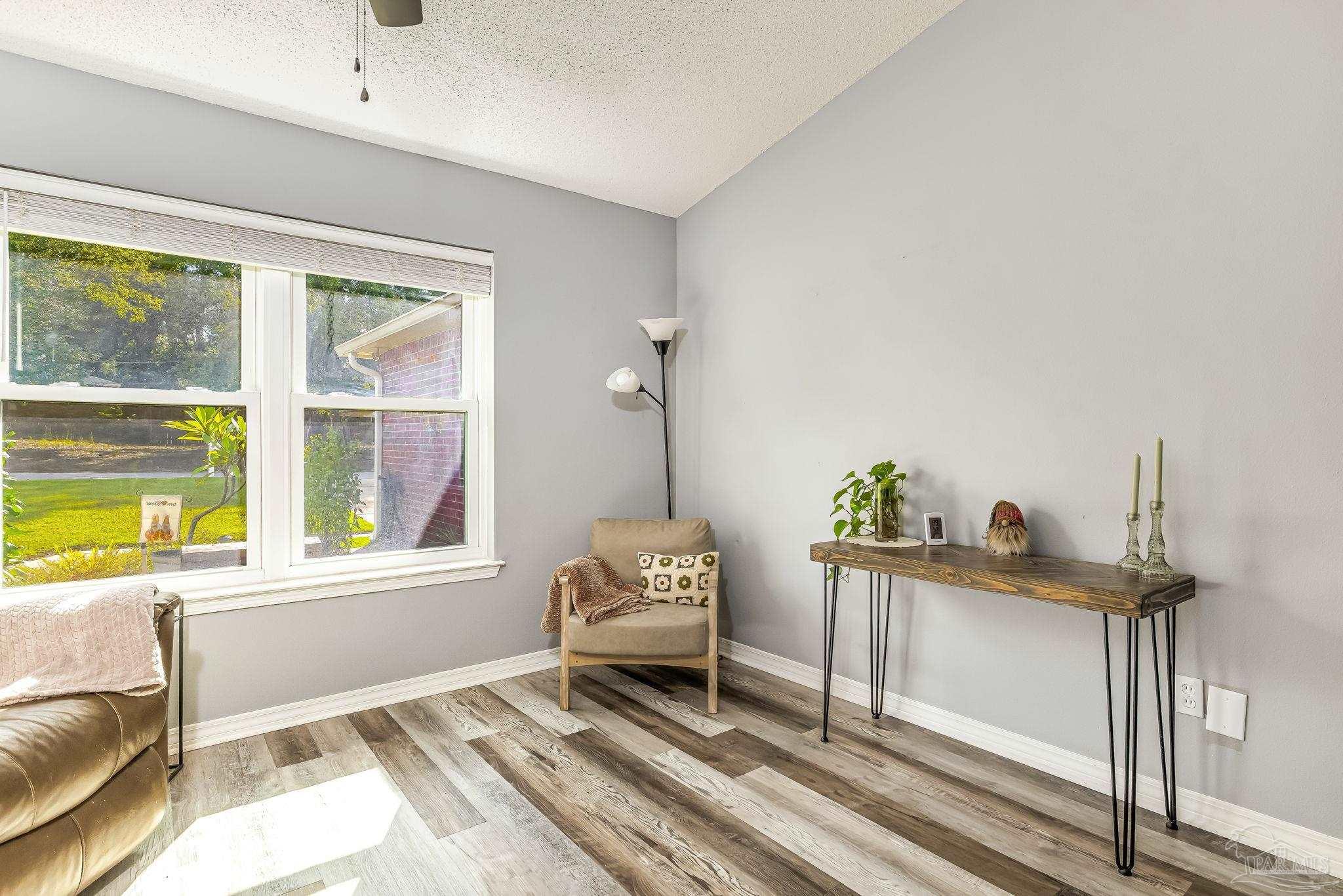 2000 Winners Circle Cantonment, FL 32533 - Photo 12 of 59 a living room with furniture and a window