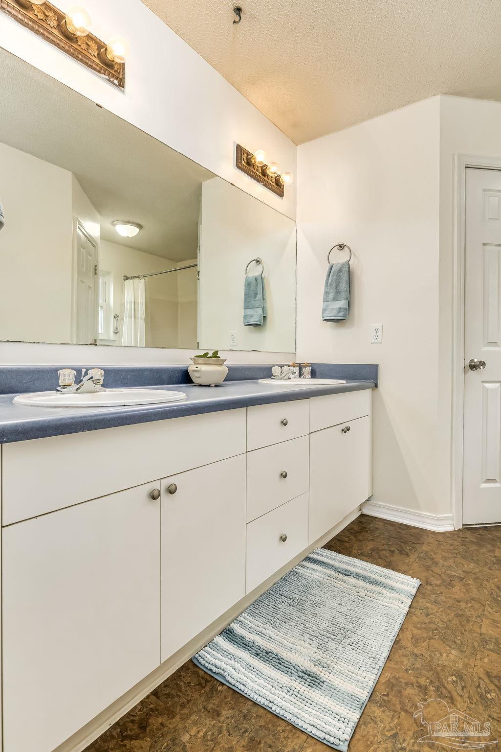 2000 Winners Circle Cantonment, FL 32533 - Photo 28 of 59 a bathroom with a sink and mirror
