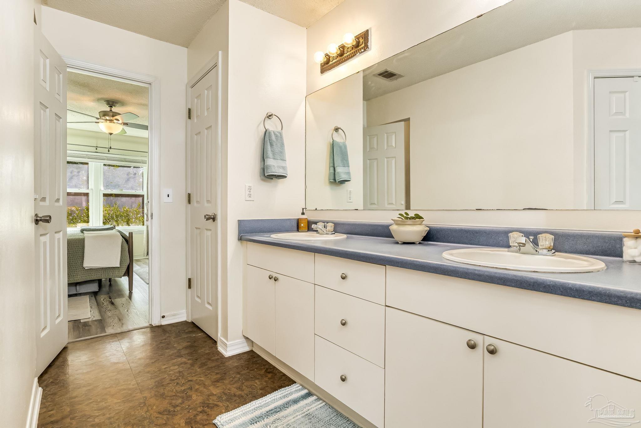 2000 Winners Circle Cantonment, FL 32533 - Photo 30 of 59 a bathroom with a sink and a mirror