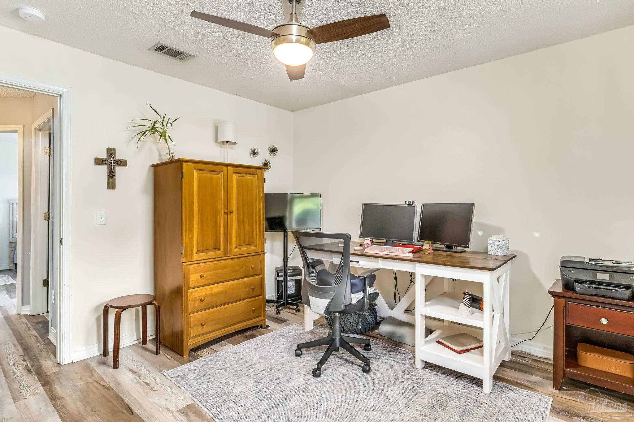 2000 Winners Circle Cantonment, FL 32533 - Photo 33 of 59 a view of a workspace with furniture and a window