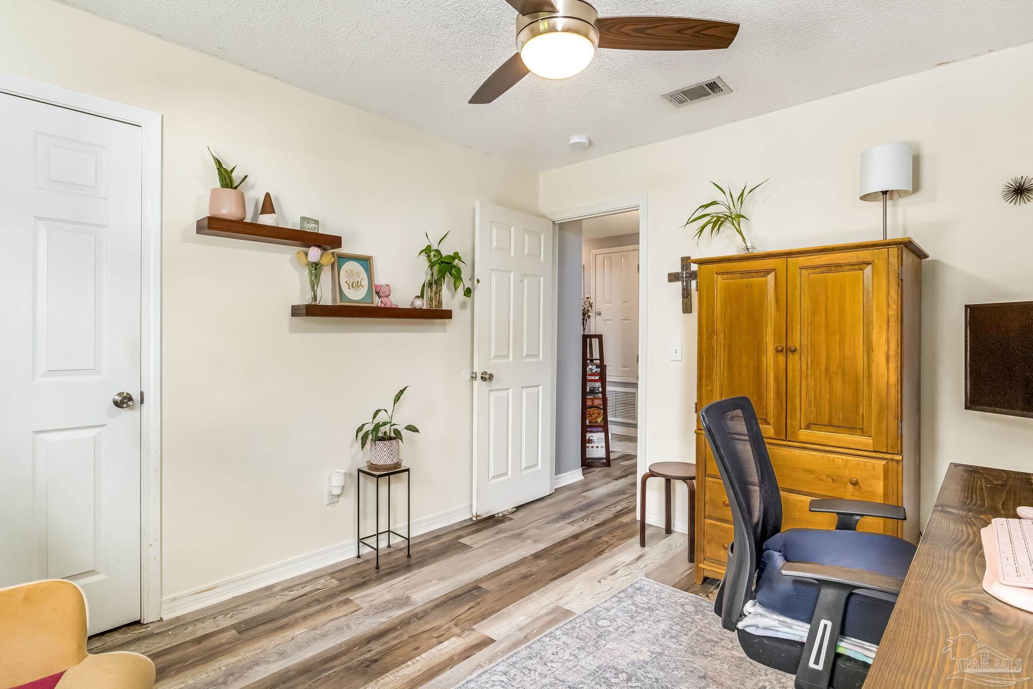 2000 Winners Circle Cantonment, FL 32533 - Photo 34 of 59 a view of a hallway with workspace and a window