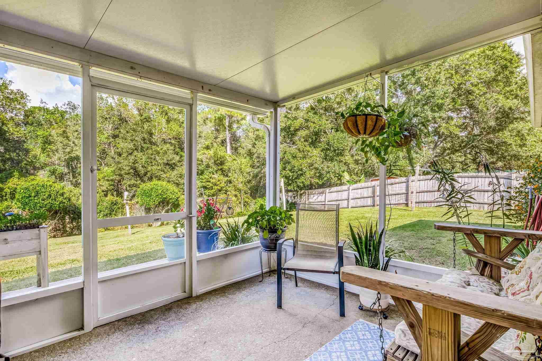 2000 Winners Circle Cantonment, FL 32533 - Photo 41 of 59 a balcony with furniture and a potted plant
