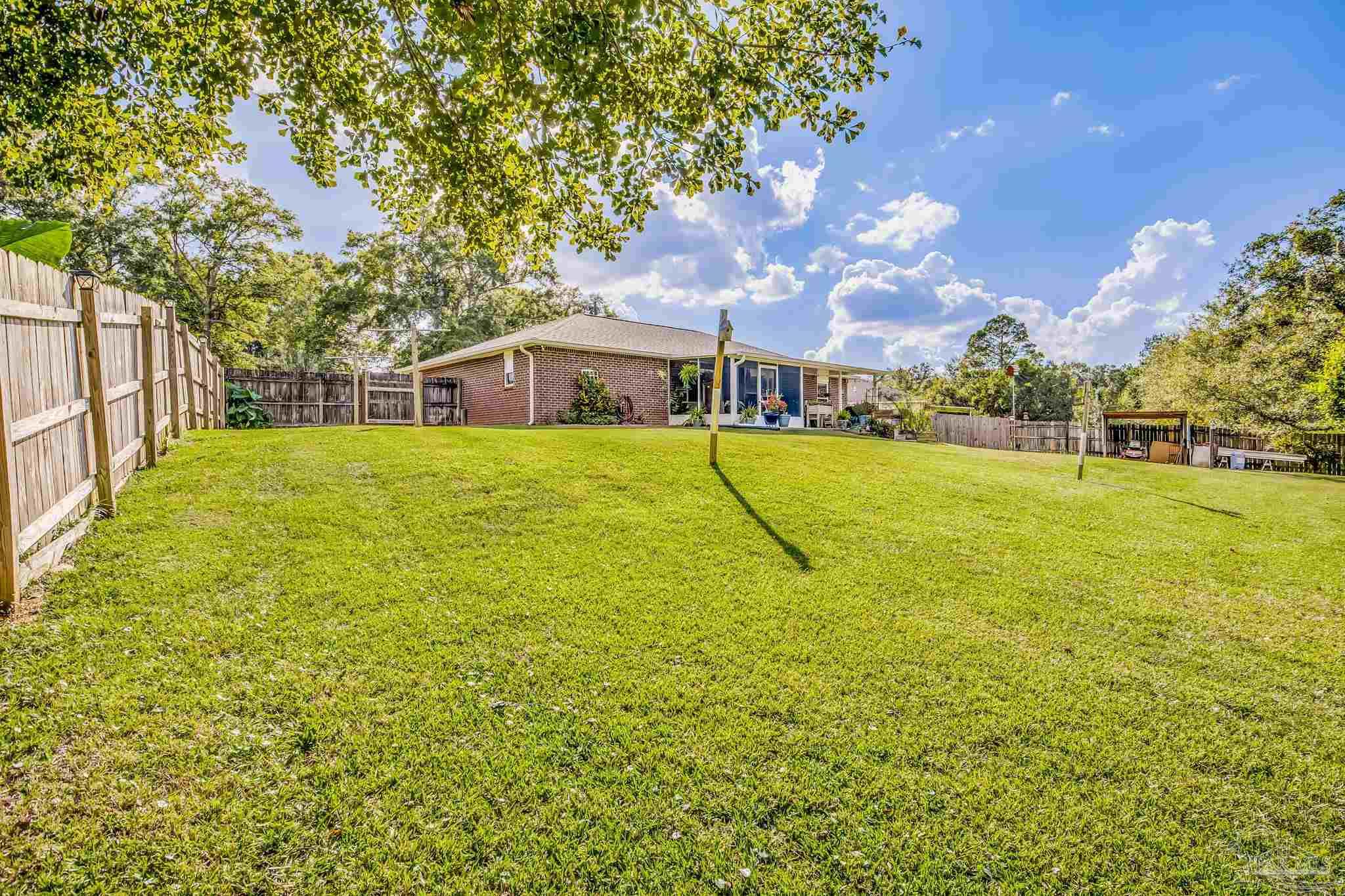2000 Winners Circle Cantonment, FL 32533 - Photo 51 of 59 a view of a playground with basketball court