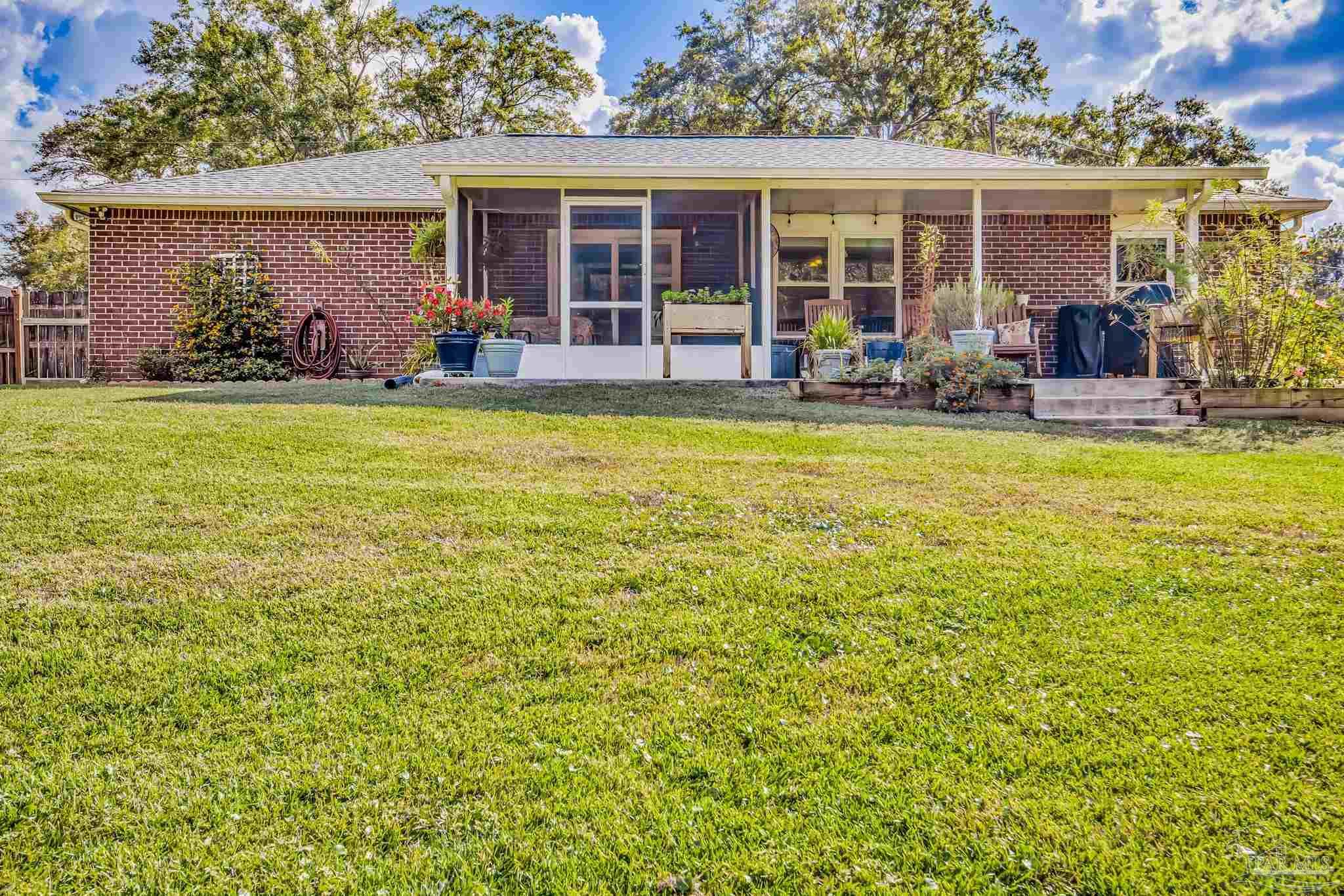 2000 Winners Circle Cantonment, FL 32533 - Photo 54 of 59 front view of a house with swimming pool in front of it