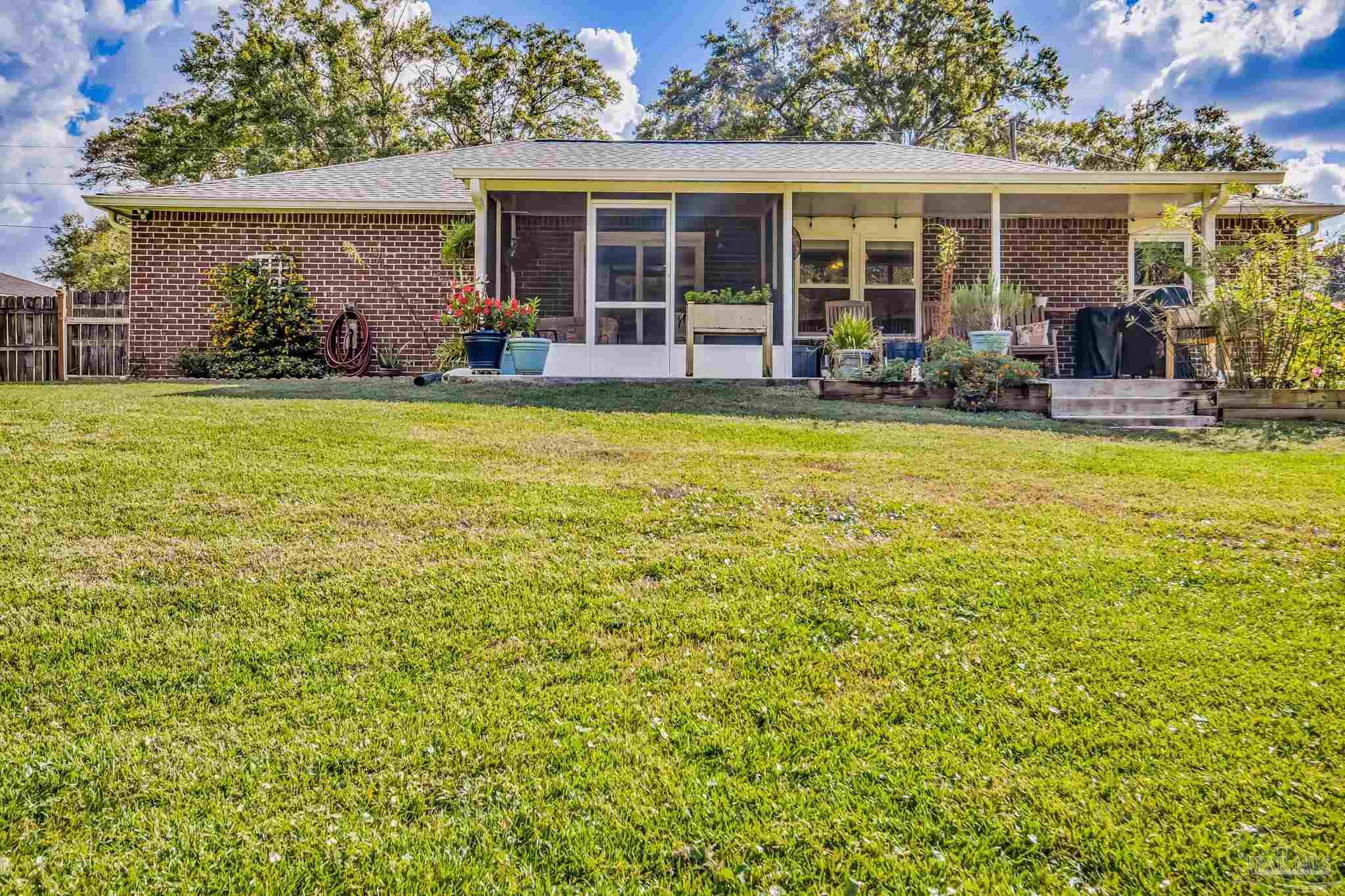 2000 Winners Circle Cantonment, FL 32533 - Photo 55 of 59 front view of a house with a patio
