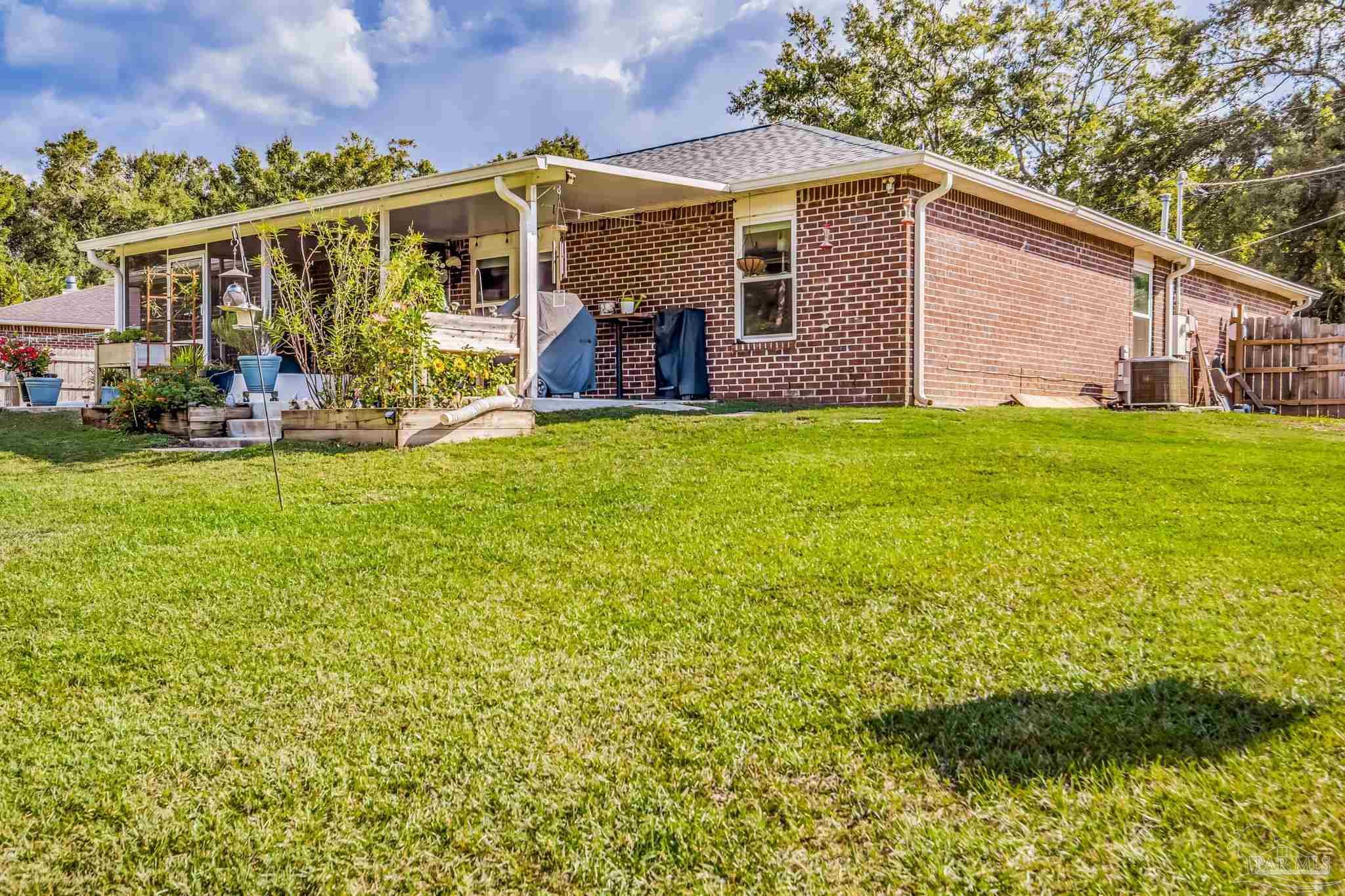 2000 Winners Circle Cantonment, FL 32533 - Photo 57 of 59 a front view of house with yard and seating area