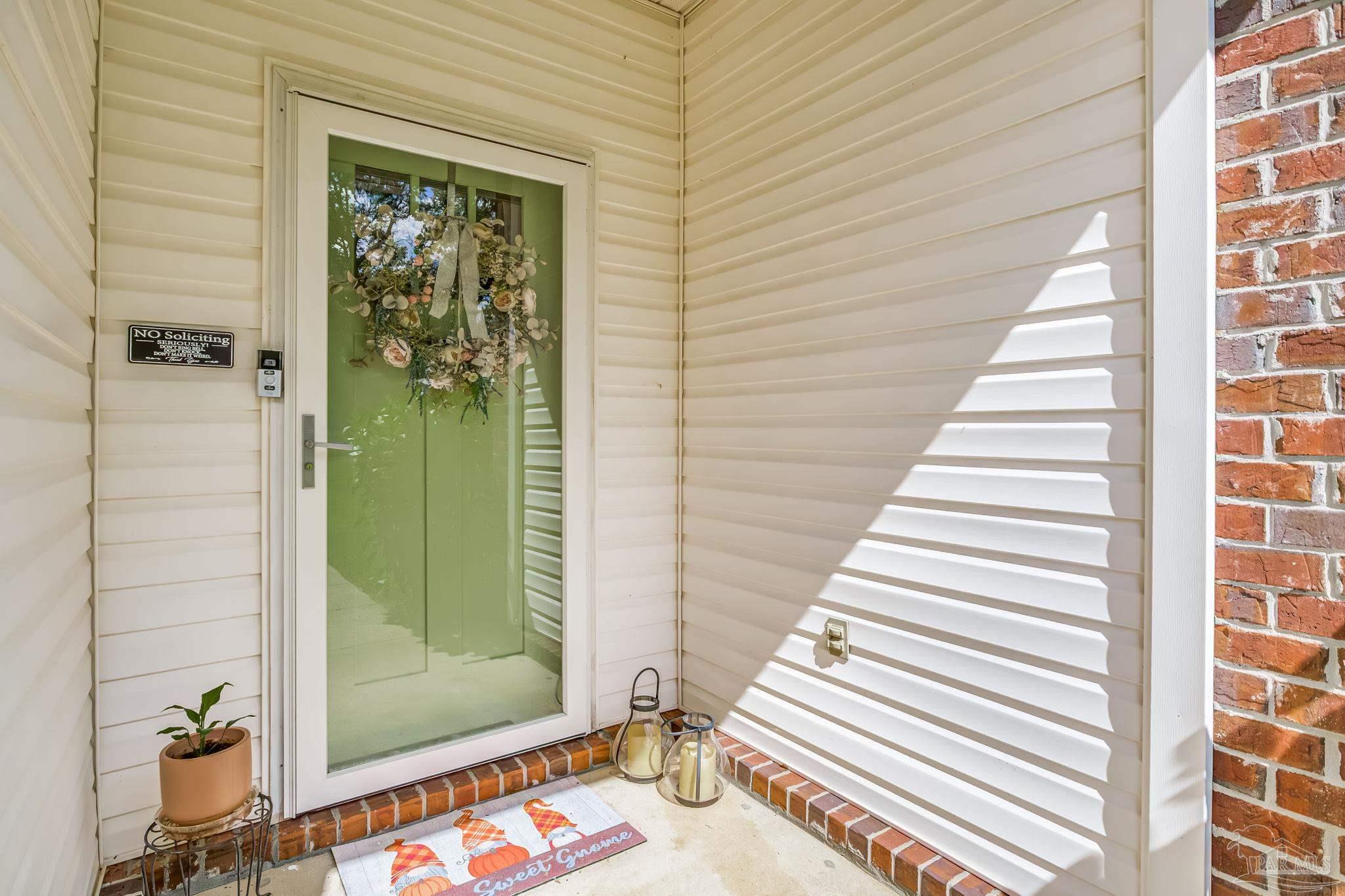 2000 Winners Circle Cantonment, FL 32533 - Photo 6 of 59 a view of a entryway door of the house