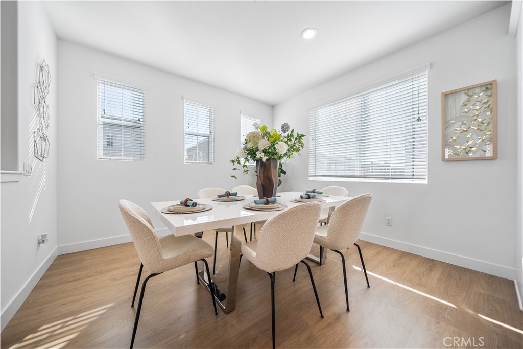 11016 Getaway Drive Rancho Cucamonga, CA 91730 - Photo 11 of 44 a view of a dining room with furniture window and wooden floor