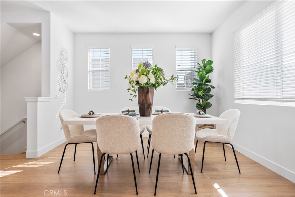 11016 Getaway Drive Rancho Cucamonga, CA 91730 - Photo 12 of 44 a view of a dining room with furniture window and wooden floor