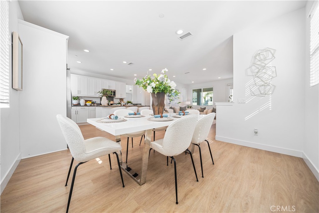11016 Getaway Drive Rancho Cucamonga, CA 91730 - Photo 13 of 44 a dining room with furniture and wooden floor