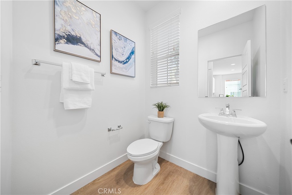 11016 Getaway Drive Rancho Cucamonga, CA 91730 - Photo 18 of 44 a bathroom with a toilet a sink and a mirror