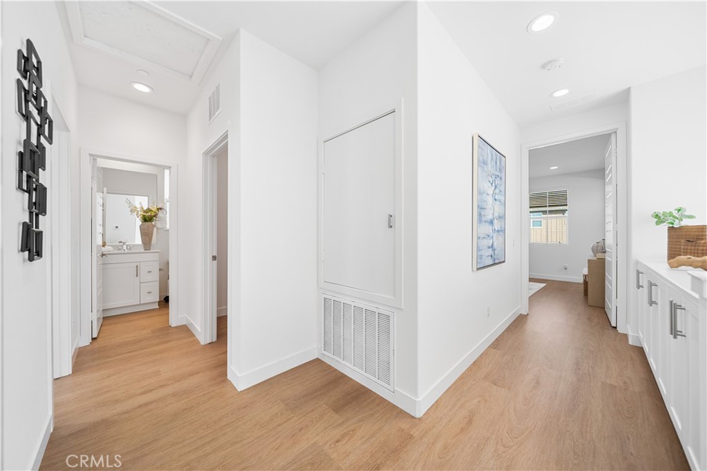 11016 Getaway Drive Rancho Cucamonga, CA 91730 - Photo 21 of 44 a view of a hallway with wooden floor