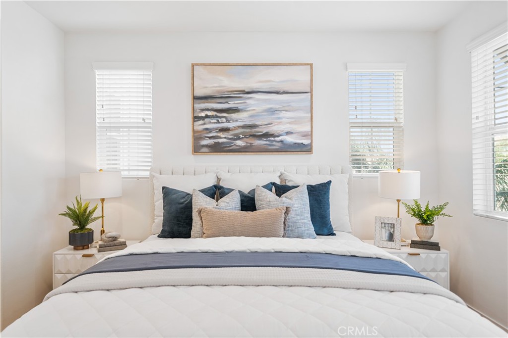 11016 Getaway Drive Rancho Cucamonga, CA 91730 - Photo 24 of 44 a spacious bedroom with furniture and a potted plant