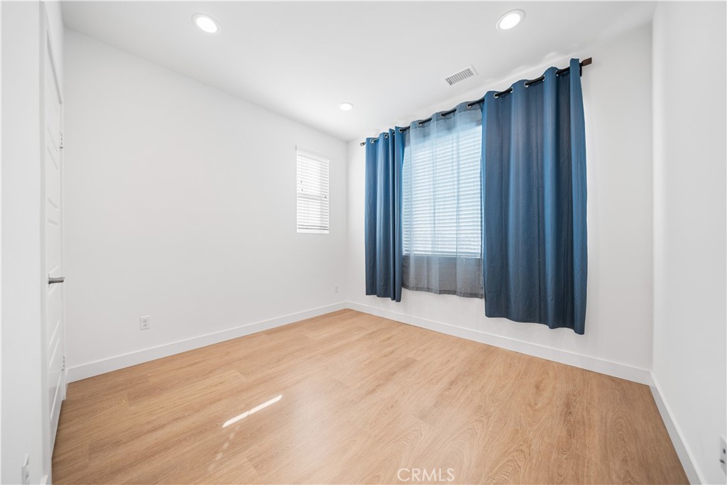 11016 Getaway Drive Rancho Cucamonga, CA 91730 - Photo 30 of 44 an empty room with windows