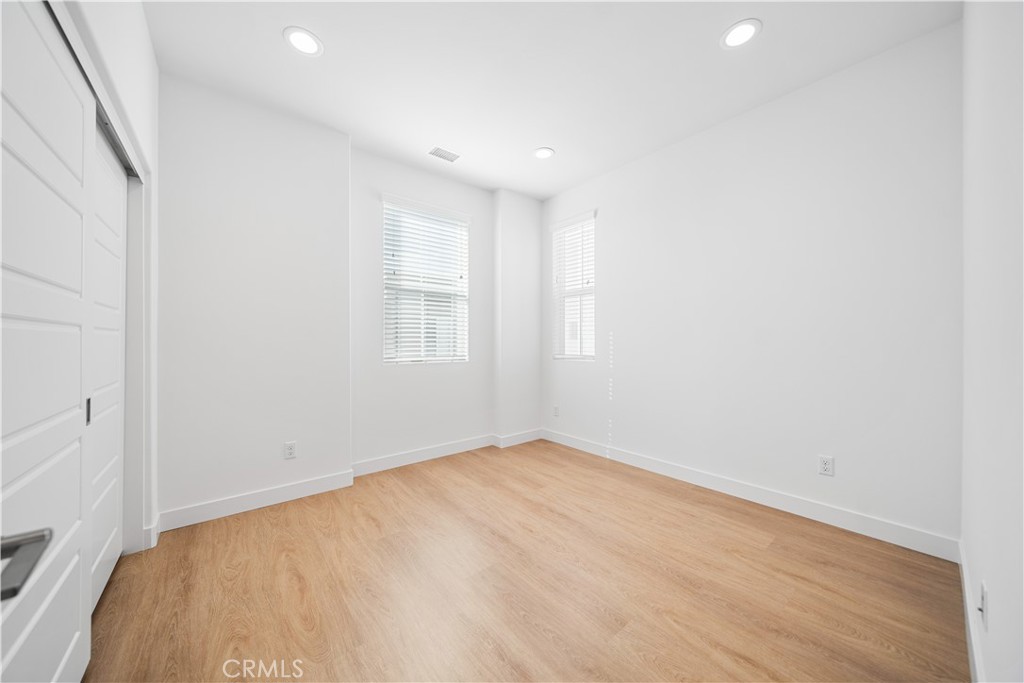 11016 Getaway Drive Rancho Cucamonga, CA 91730 - Photo 32 of 44 an empty room with windows