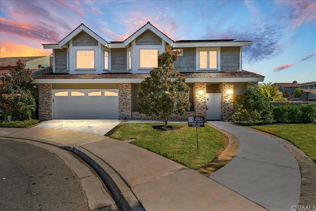 19 Mallard Irvine, CA 92604 - Photo 1 of 1 a front view of a house with a yard and garage