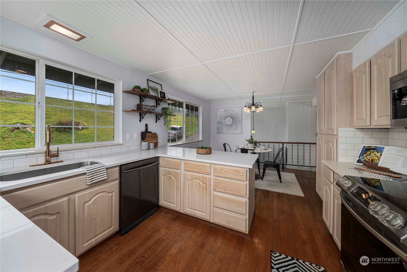 2004 North E Street Aberdeen, WA 98520 - Photo 11 of 38 a kitchen with a sink stove and cabinets