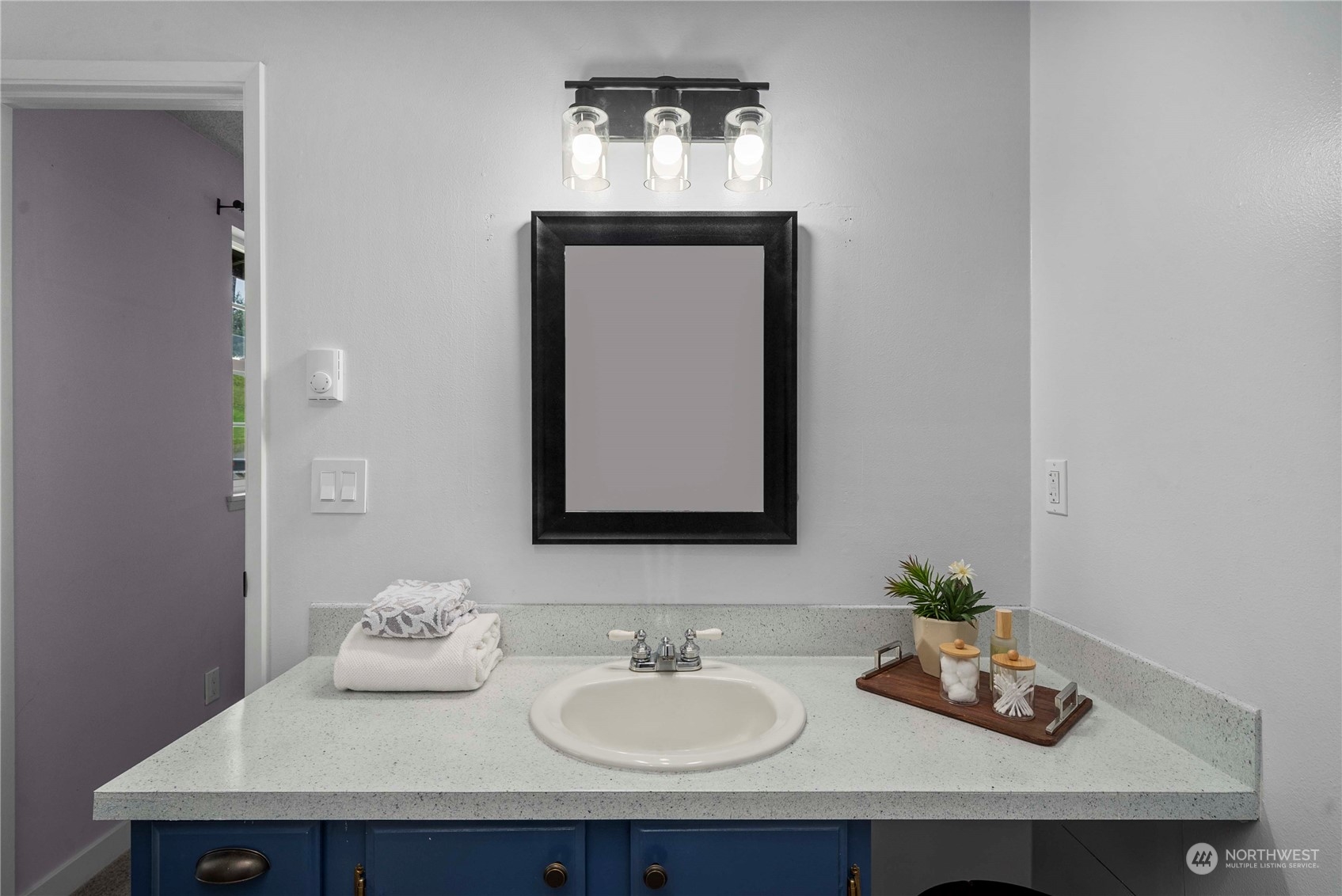 2004 North E Street Aberdeen, WA 98520 - Photo 14 of 38 a bathroom with a sink and a mirror