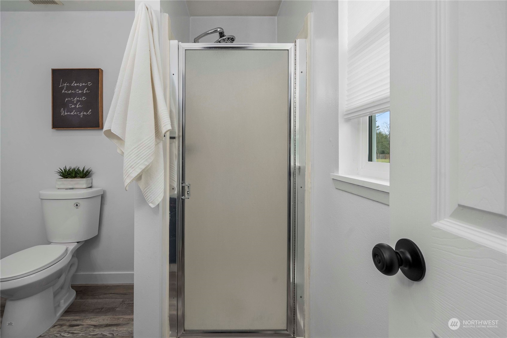 2004 North E Street Aberdeen, WA 98520 - Photo 15 of 38 a bathroom with a toilet and a mirror