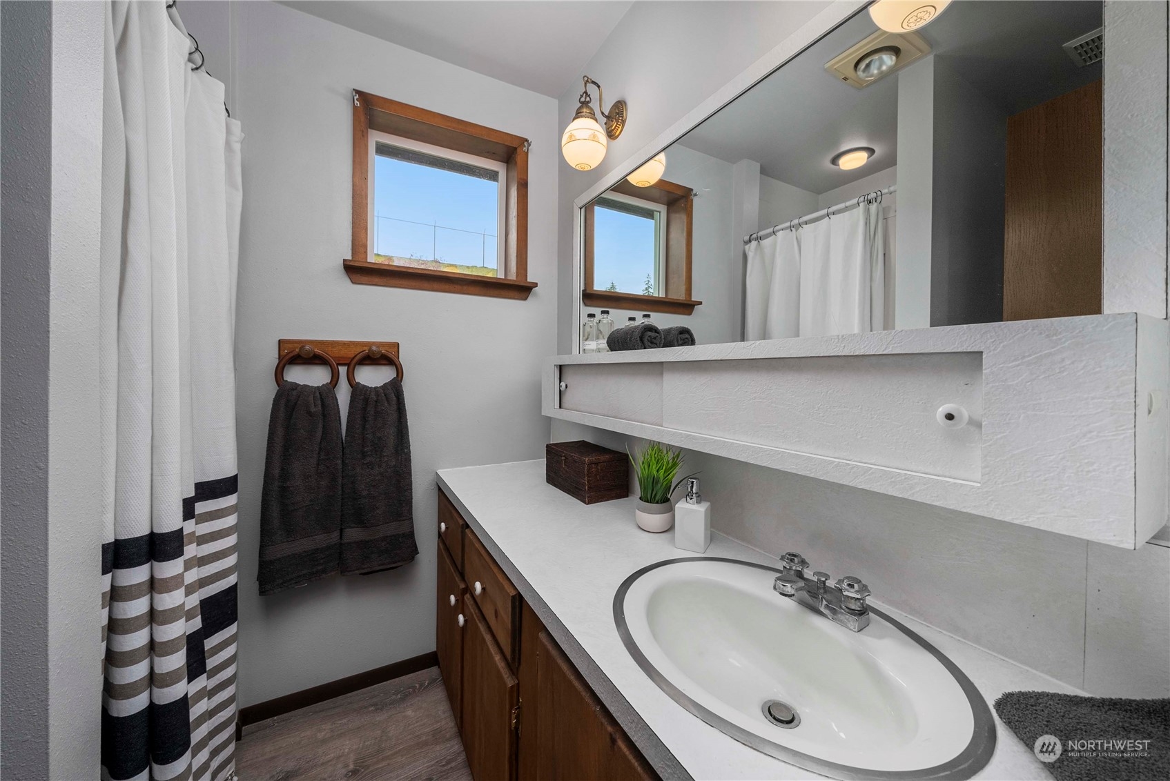 2004 North E Street Aberdeen, WA 98520 - Photo 23 of 38 a bathroom with a sink double vanity and a mirror