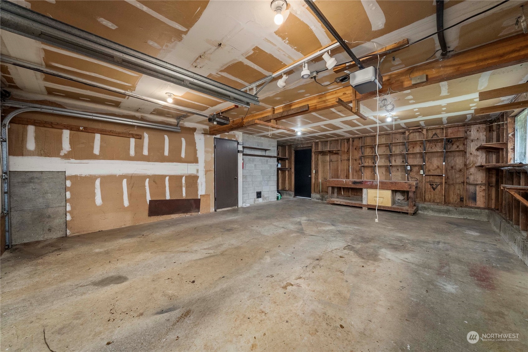 2004 North E Street Aberdeen, WA 98520 - Photo 35 of 38 a view of an empty room with a garage
