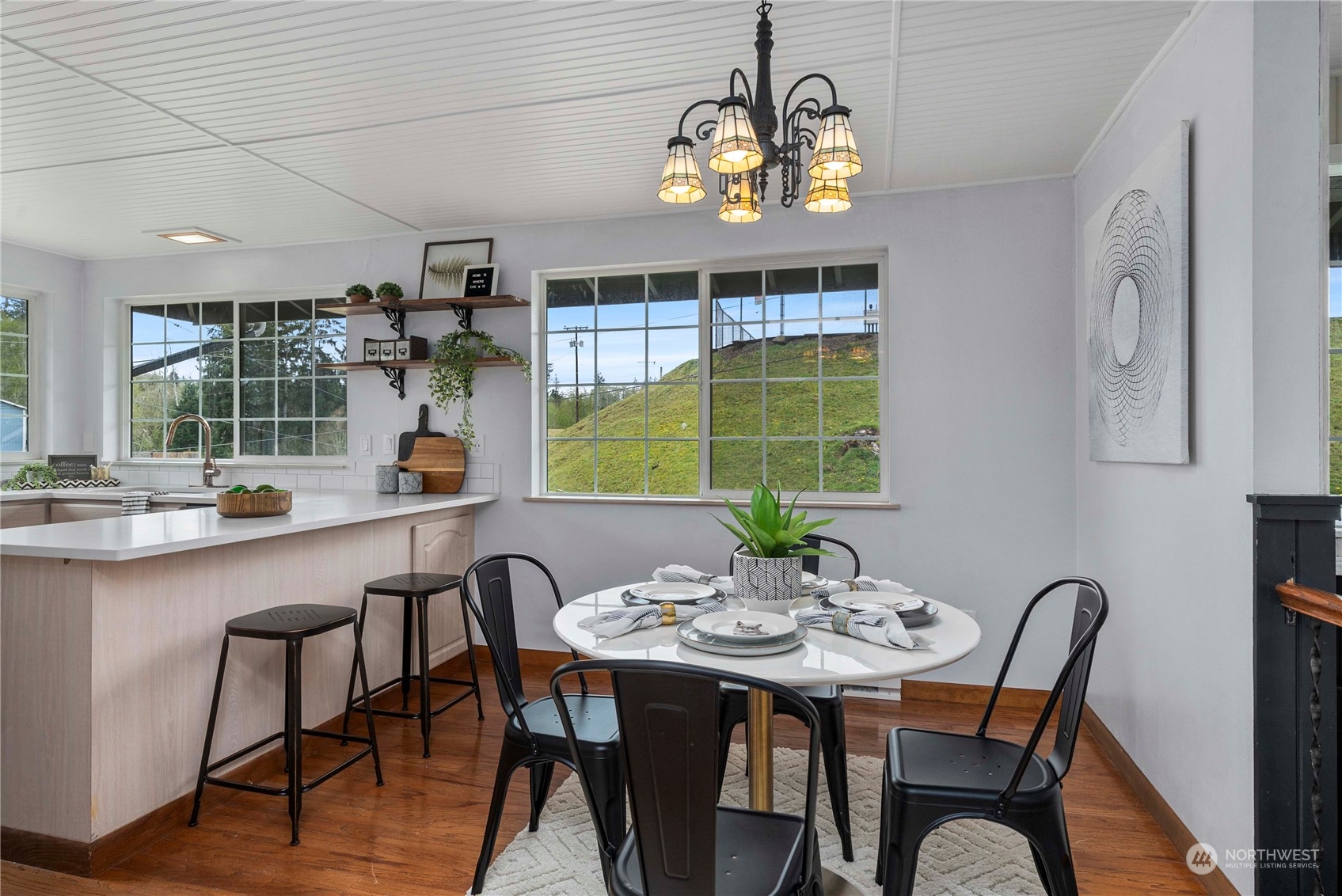 2004 North E Street Aberdeen, WA 98520 - Photo 6 of 38 a view of a dining room with furniture a chandelier and wooden floor