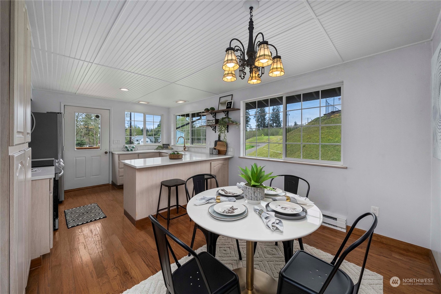2004 North E Street Aberdeen, WA 98520 - Photo 7 of 38 a view of a dining room with furniture a chandelier and wooden floor