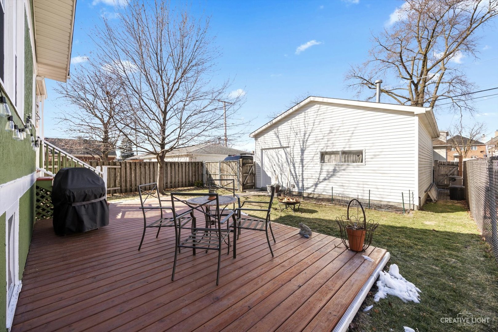 4534 Deyo Avenue Brookfield, IL 60513 - Photo 16 of 17 a view of a chairs and table on the wooden deck