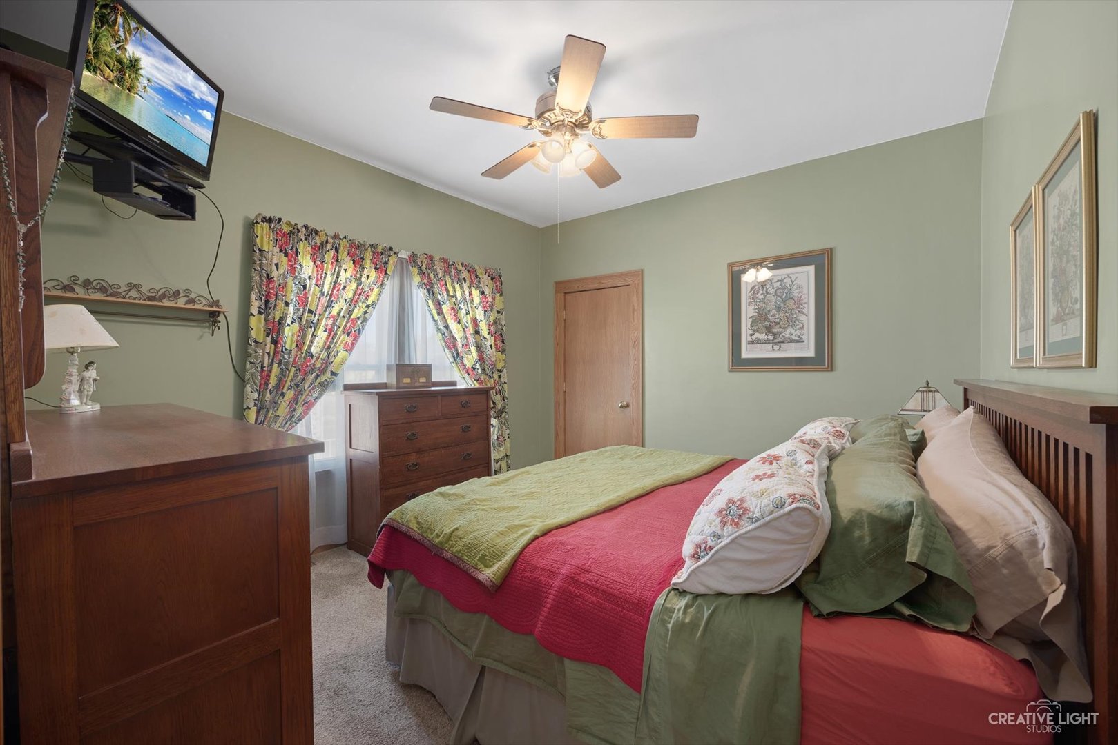 4534 Deyo Avenue Brookfield, IL 60513 - Photo 10 of 17 a bedroom with a bed and a flat screen tv
