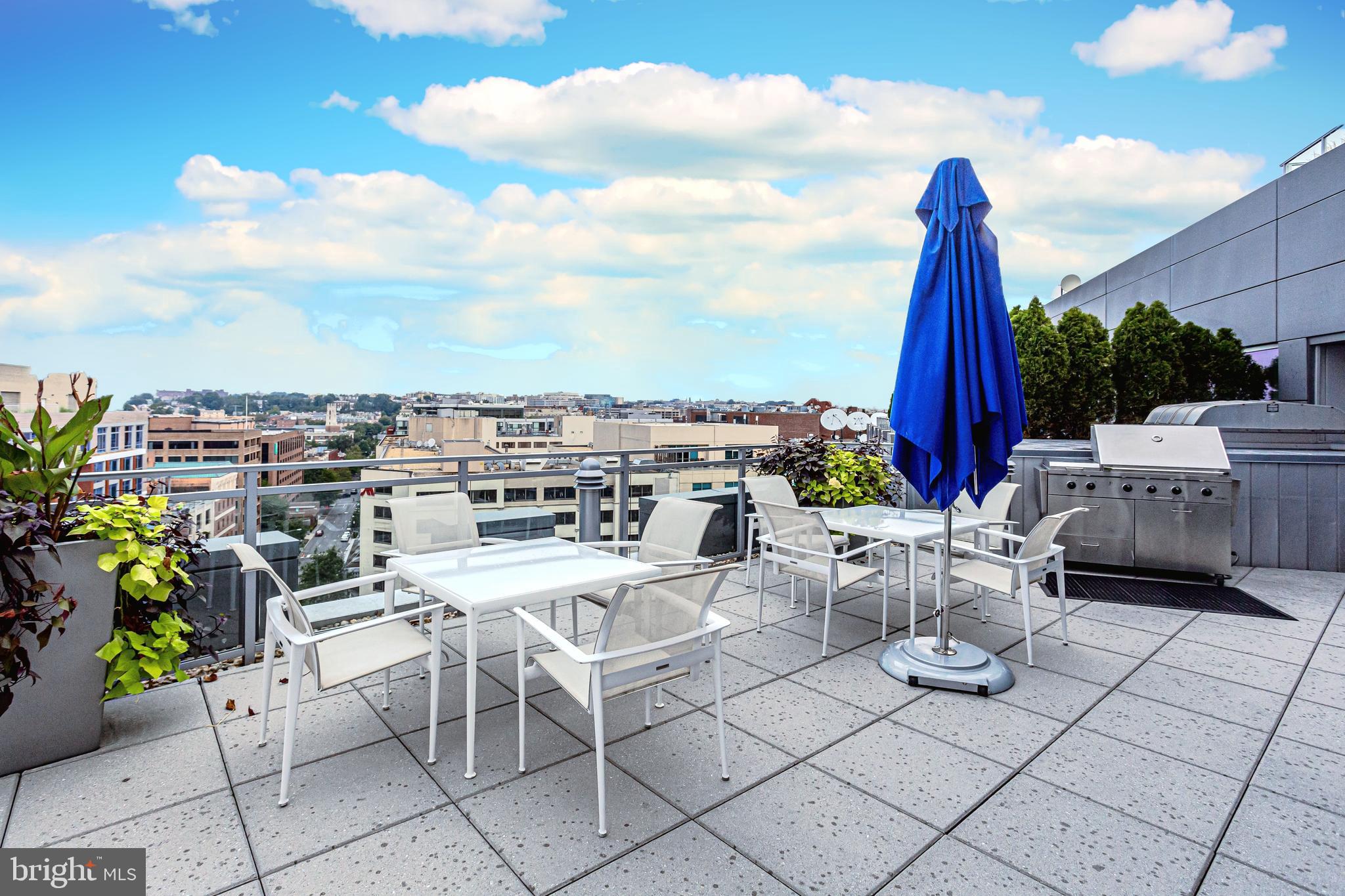 1177 22nd Street Northwest, Unit 3M Washington, DC 20037 - Photo 18 of 26 Rooftop grilling and lounge area