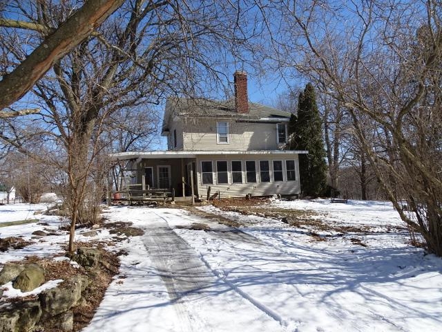 2182 North Flansburg Road Freeport, IL 61032 - Photo 4 of 23 a view of a house with a yard covered in snow