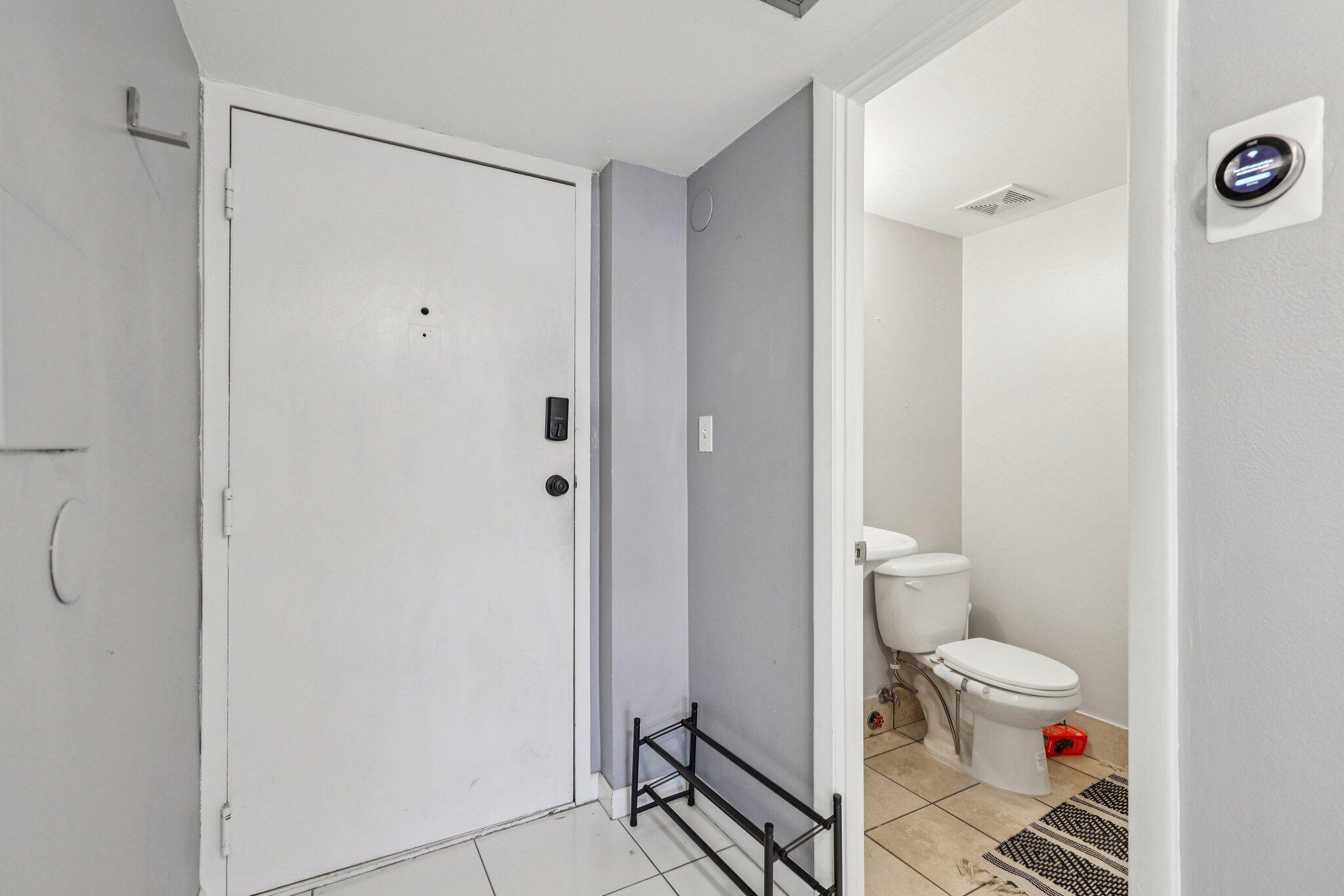 6500 Cypress Road, Unit 508 Plantation, FL 33317 - Photo 13 of 32 a bathroom with a toilet and a shower