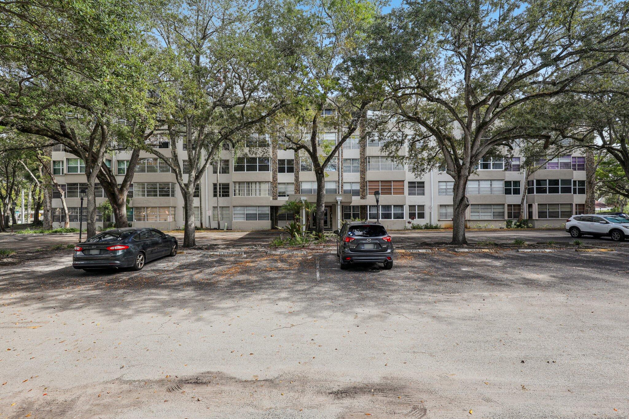 6500 Cypress Road, Unit 508 Plantation, FL 33317 - Photo 25 of 32 a view of street with parked cars
