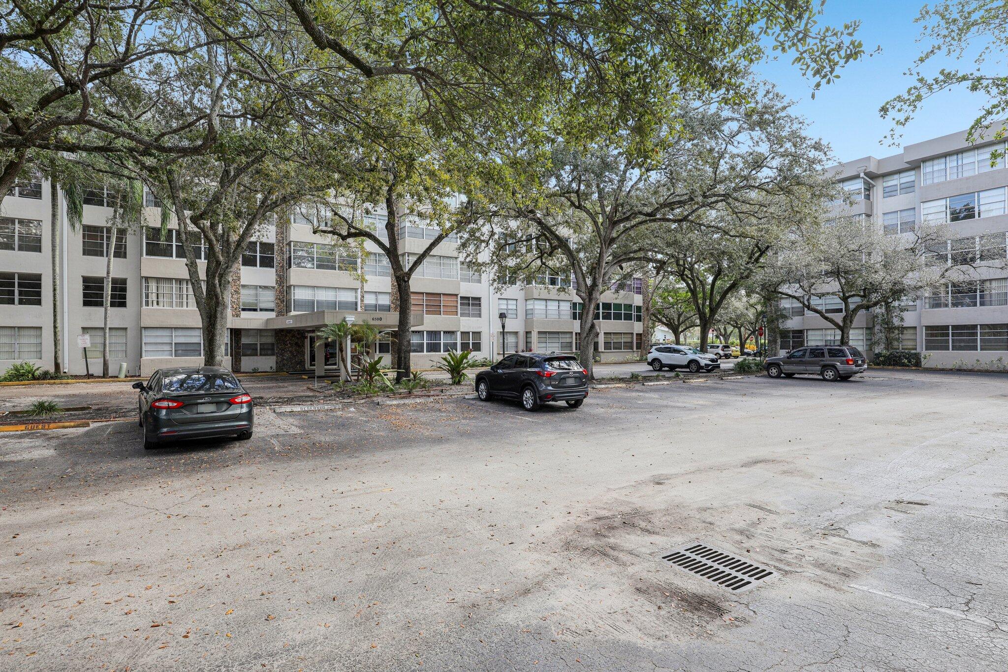 6500 Cypress Road, Unit 508 Plantation, FL 33317 - Photo 28 of 32 a view of street with parked cars