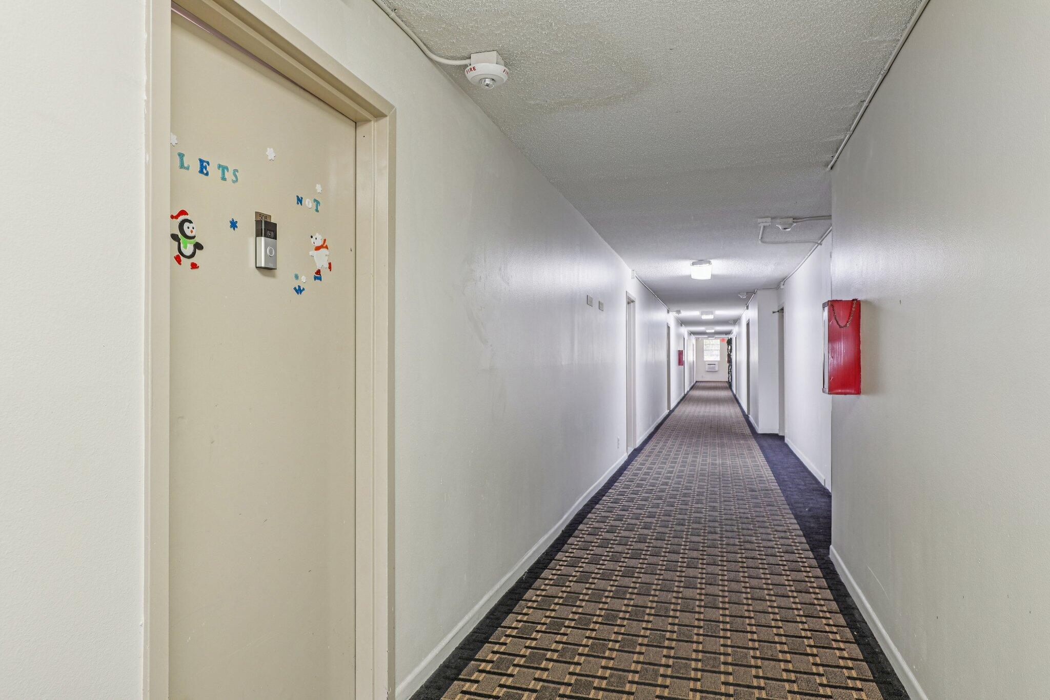 6500 Cypress Road, Unit 508 Plantation, FL 33317 - Photo 32 of 32 a hallway with wooden floor
