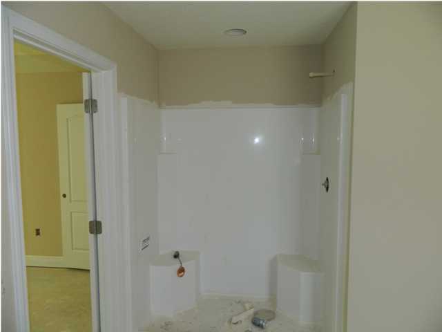 4505 Hermosa Road Crestview, FL 32539 - Photo 16 of 18 a bathroom with a shower
