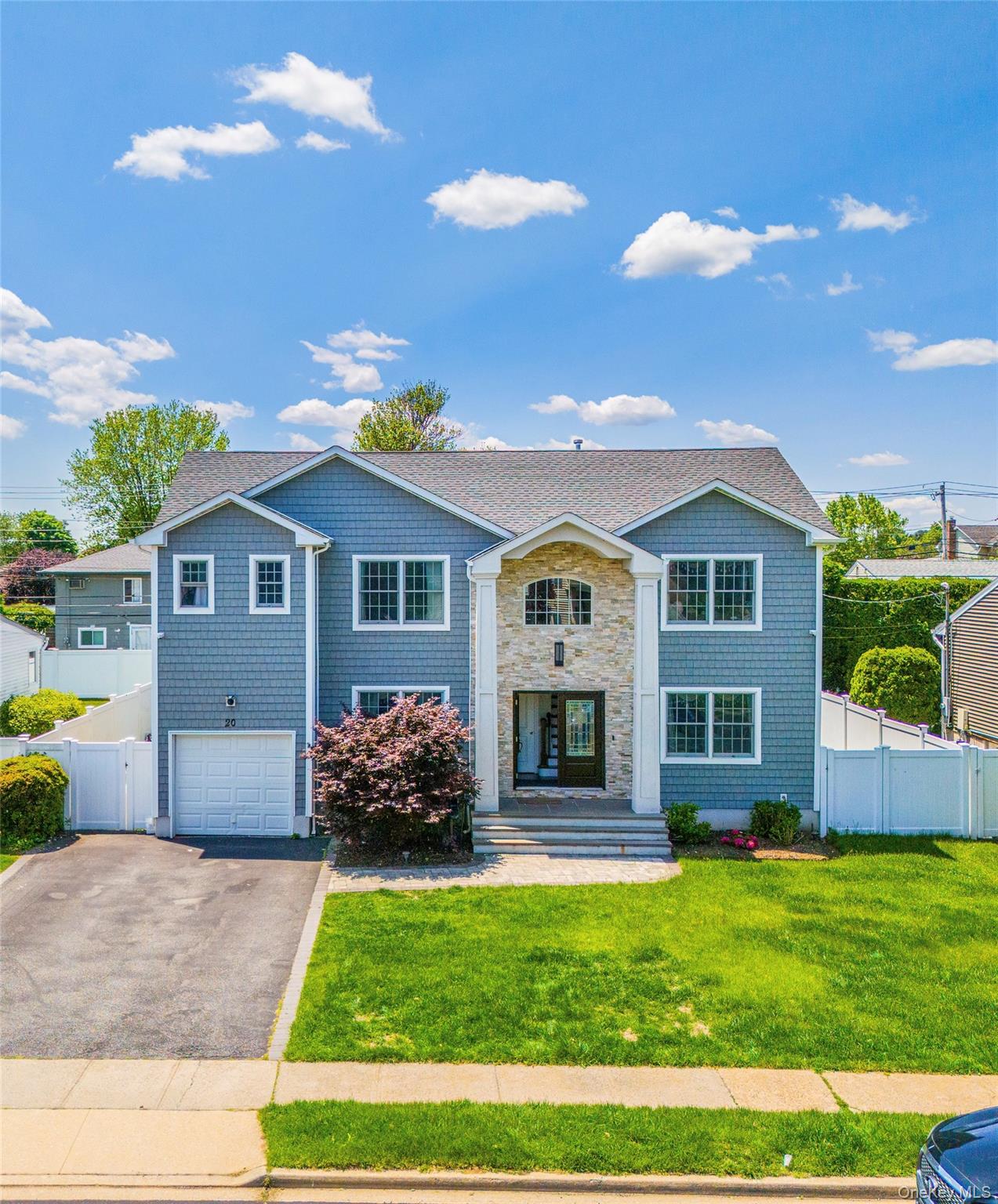 20 Frederick Drive Plainview, NY 11803 - Photo 1 of 1 a front view of a house with a yard