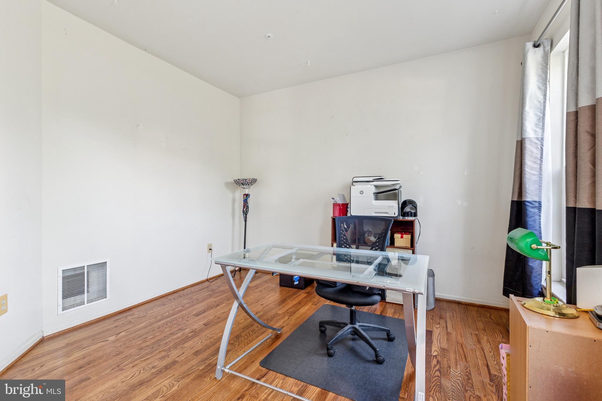 3401 Kidder Road Clinton, MD 20735 - Photo 3 of 45 a view of a workspace with furniture and wooden floor
