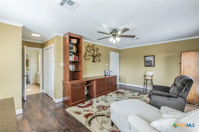 a en suite bathroom with a double vanity sink and a mirror