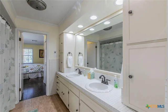 a view of a porch with chairs and potted plants
