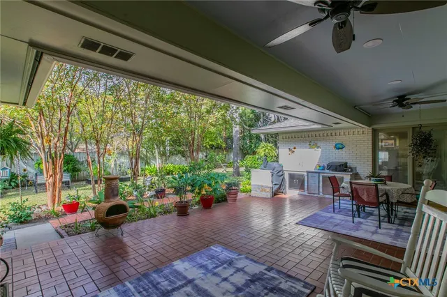 a view of a dining room with furniture and window