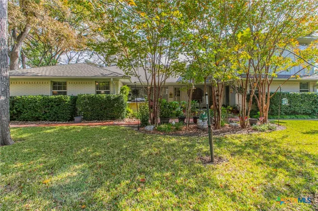 a view of swimming pool with garden