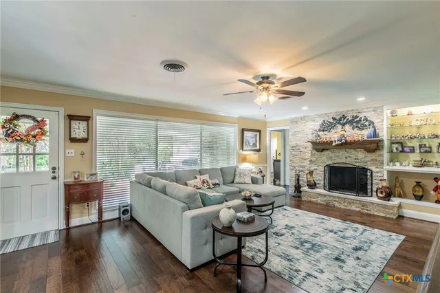 a living room with furniture and a fireplace