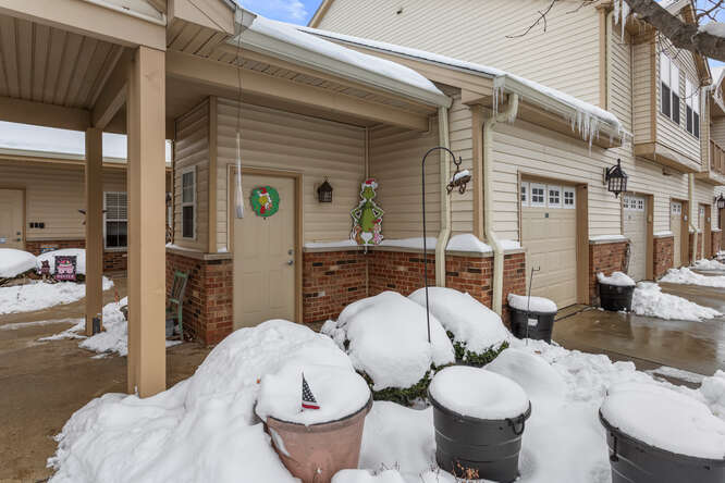 3761 Thornhill Circle Champaign, IL 61822 - Photo 2 of 18 a view of a patio with table and chairs potted plants and floor to ceiling window