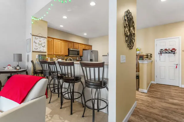 a kitchen with stainless steel appliances a refrigerator and a sink