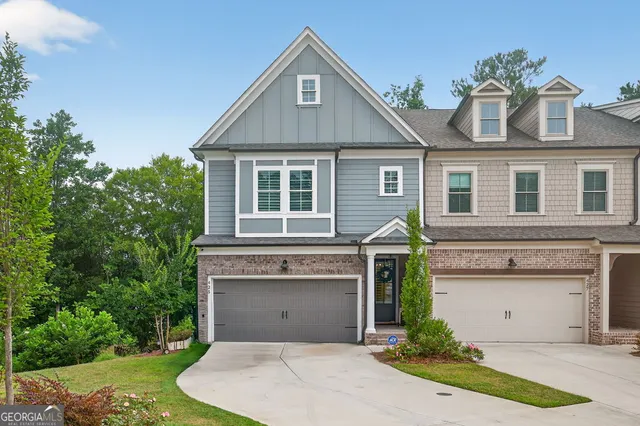 a front view of a house with a yard garage and garage