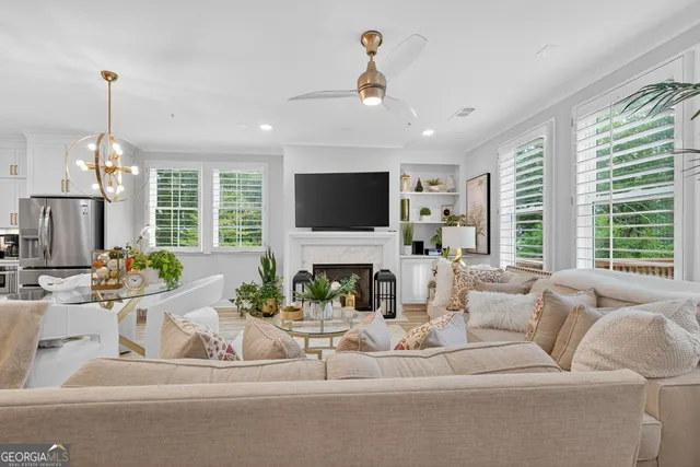 a living room with furniture fireplace and flat screen tv