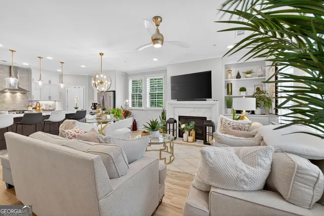 a bedroom with a large bed and potted plant