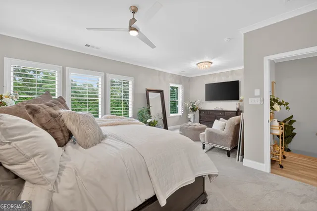a white toilet sitting next to a white sink and a shower curtain
